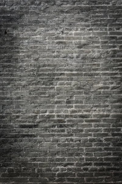 Donkere bakstenen muur achtergrond — Stockfoto