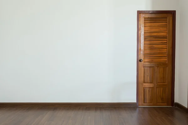 Empty room, white mortar wall background and wood laminate floor — Stock Photo, Image