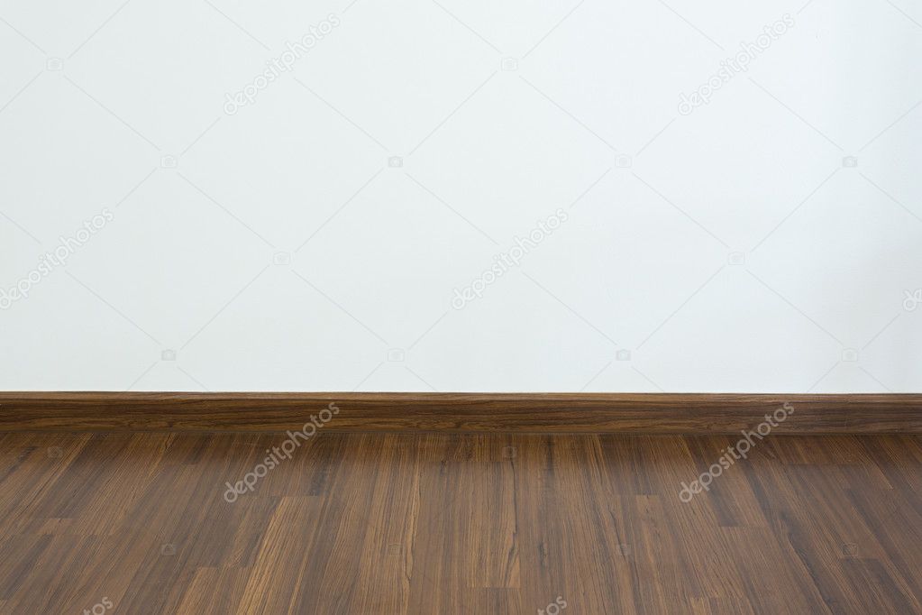 empty room, white mortar wall background and wood laminate floor