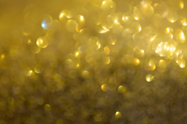 Gold bakgrund, abstrakt gyllene bokeh ljus firandet — Stockfoto