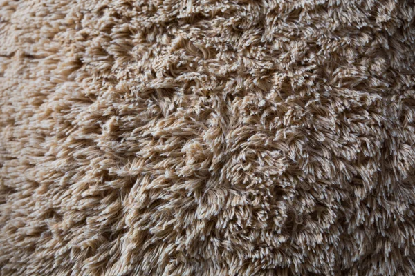 Primer plano lana marrón esponjoso piel textura fondo — Foto de Stock