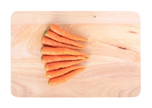 Carrot on wooden chopping board — Stock Photo, Image