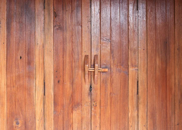 Door handle on brown wood door — Stock Photo, Image