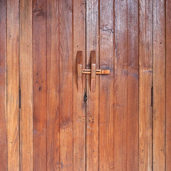 Door handle on brown wood door — Stock Photo, Image