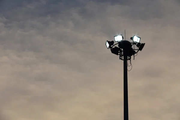 Spotlight with sky background — Stock Photo, Image