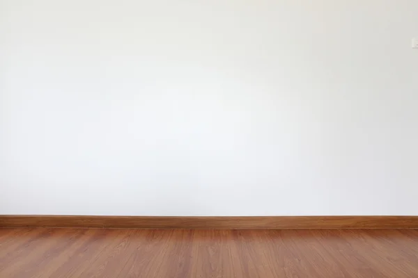 White mortar wall and wood floor in the room — Stock Photo, Image