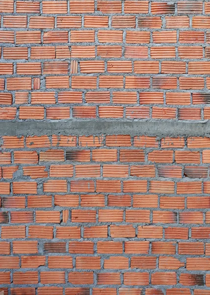 Mur de briques dans le chantier de construction de bâtiments résidentiels — Photo