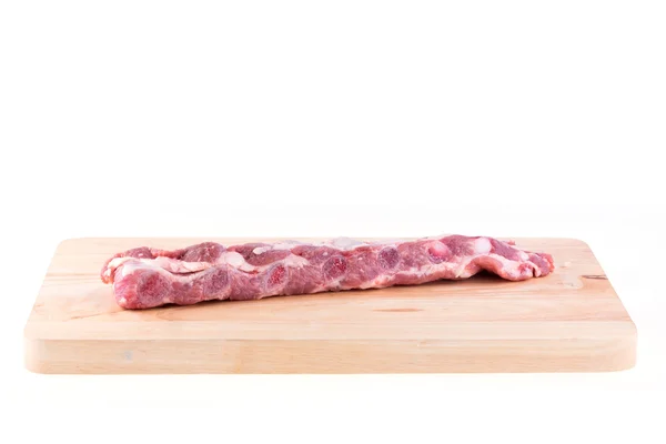 Spare ribs raw on wood board isolated — Stock Photo, Image