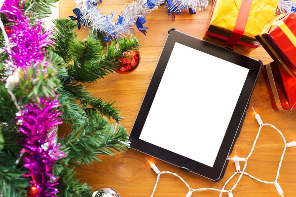 Black tablet on table wood with christmas decoration — Stock Photo, Image