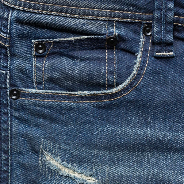 Blue denim jeans pocket with design torn — Stock Photo, Image