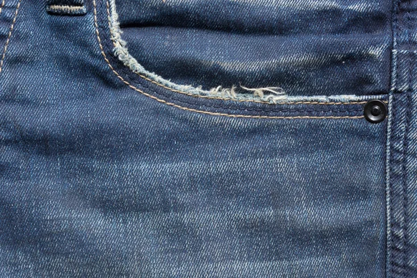 Blue denim jeans pocket with design torn — Stock Photo, Image