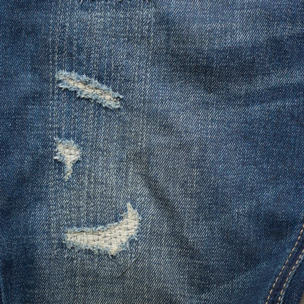 Denim jeans blå gammal slits med modedesign — Stockfoto