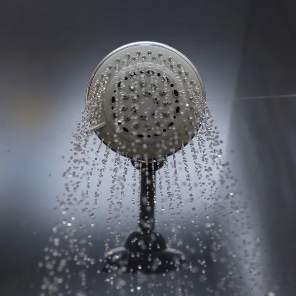 Shower head with water drops flowing Stock Photo by ©Sutichak 59193873