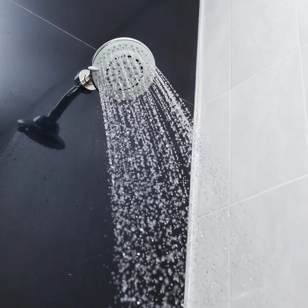 Shower head with water drops flowing — Stock Photo, Image