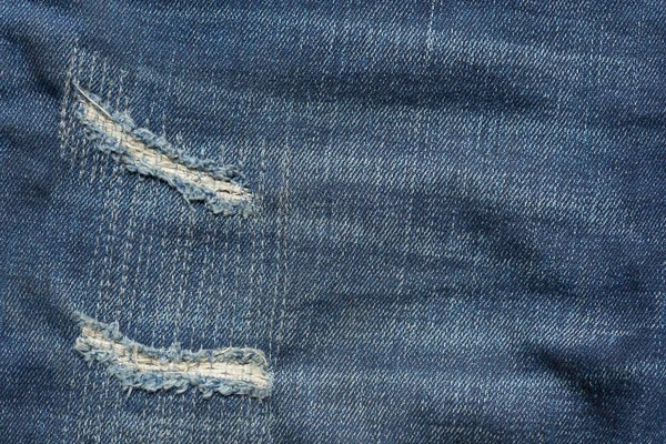 Denim jeans blå gammal slits med modedesign — Stockfoto