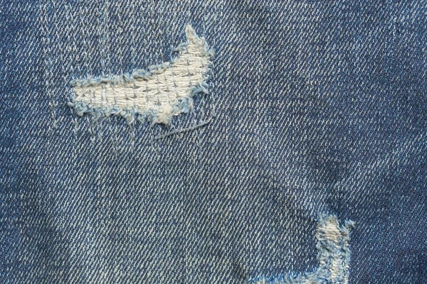 Denim jeans blå gammal slits med modedesign — Stockfoto