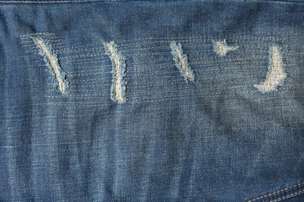 Denim jeans blå gammal slits med modedesign — Stockfoto