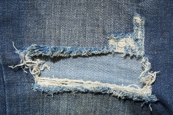 Denim jeans blue old torn with fashion design — Stock Photo, Image