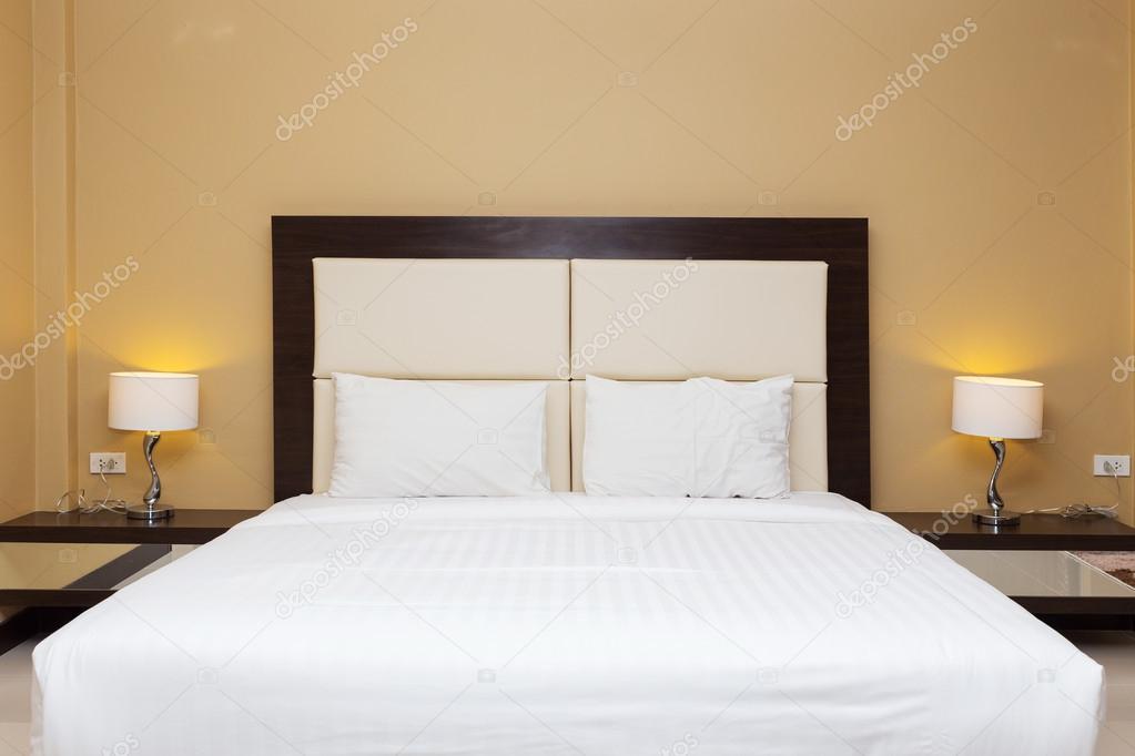 bedroom with bed and lamp decoration