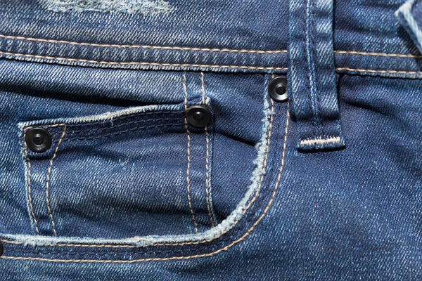 Blue denim jeans pocket with design torn — Stock Photo, Image