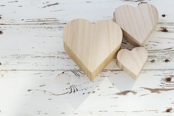 Heart wooden box on white wood background — Stock Photo, Image