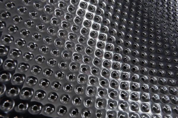 Plata acero metal agujero textura fondo —  Fotos de Stock