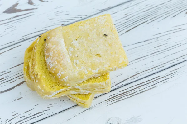 Moldy bread on white table wood — Stock Photo, Image