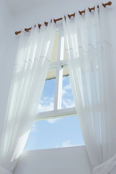 White curtain on the window with blue sky — Stock Photo, Image