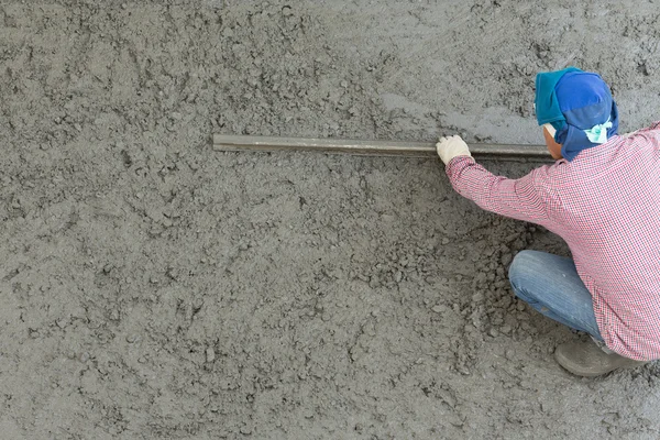 Plasterer concrete cement worker plastering flooring of house co — Stock Photo, Image