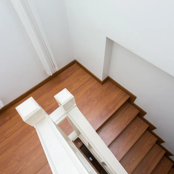 Wooden staircase made from laminate wood in white modern house — Stock Photo, Image