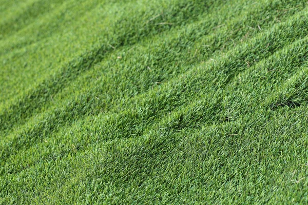 Abstrato grama textura fundo, grama verde artificial — Fotografia de Stock