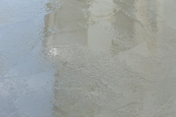 Textura de cemento húmedo en el sitio de construcción del edificio para el fondo —  Fotos de Stock