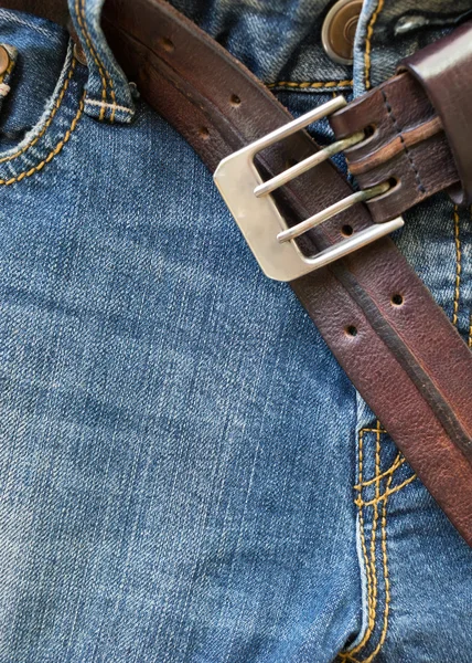 Blue jeans with brown leather belt — Stock Photo, Image