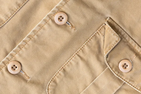 Front pocket on brown shirt textile texture background — Stock Photo, Image