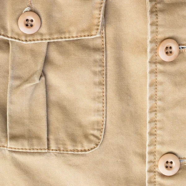 Bolso frontal na camisa marrom textura têxtil fundo — Fotografia de Stock