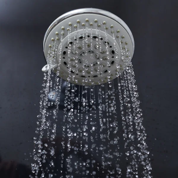 Shower head with water drops flowing — Stock Photo, Image