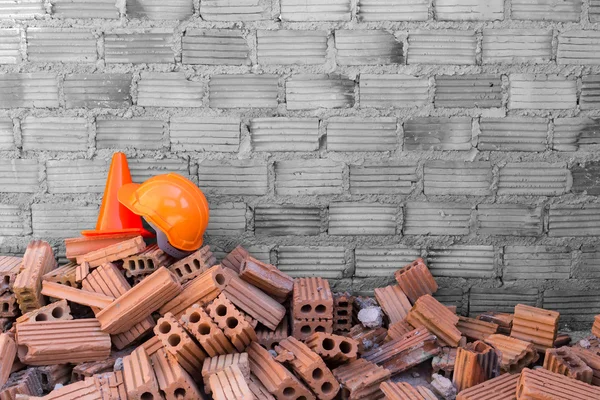 Construction helmet safety and cone in construction site — Stock Photo, Image