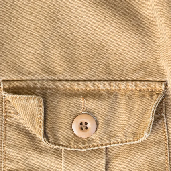 Front pocket on brown shirt textile texture background — Stock Photo, Image