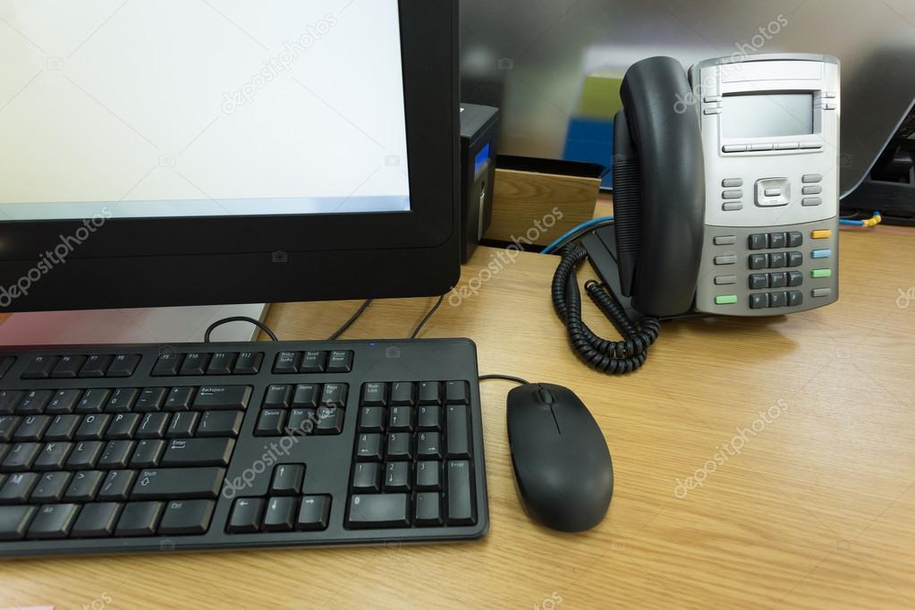 table work in office with telephone and computer pc