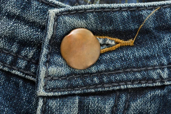 Metal botton on fashion blue jeans — Stock Photo, Image