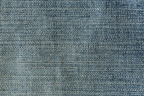 Tekstura tło włókienniczych jeansy denim — Zdjęcie stockowe