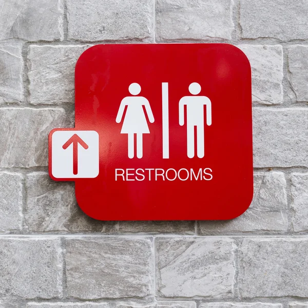 Sinais de banheiro com símbolo feminino e masculino e seta — Fotografia de Stock