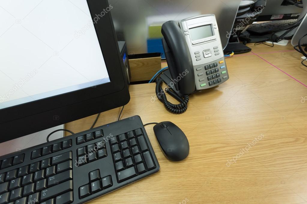 table work in office with telephone and computer pc