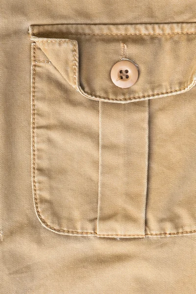 Front pocket on brown shirt textile texture background — Stock Photo, Image