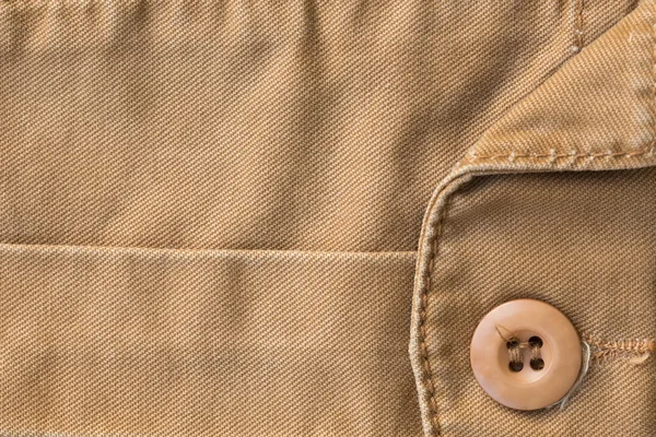 Front pocket on brown shirt textile texture background — Stock Photo, Image