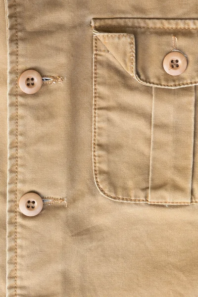 Bolsillo delantero sobre camisa marrón textura textil fondo — Foto de Stock