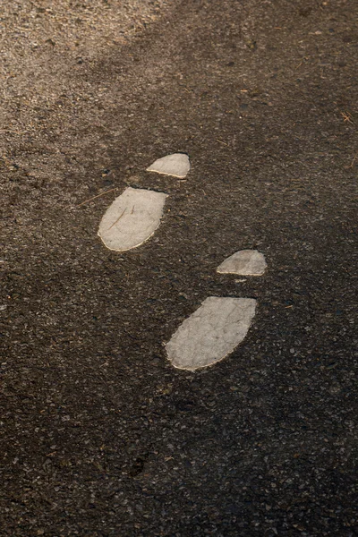 Symbol för foten promenad lane på väg — Stockfoto
