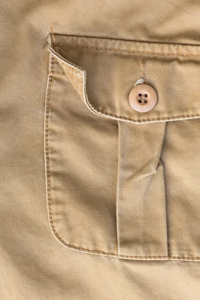 Front pocket on brown shirt textile texture background — Stock Photo, Image