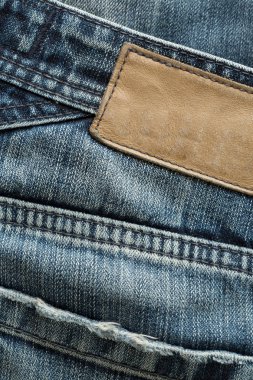 kahverengi deri etiket Etiket üzerindeki mavi jeans