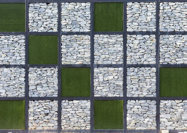 Inredning vägg med sten och gräs — Stockfoto